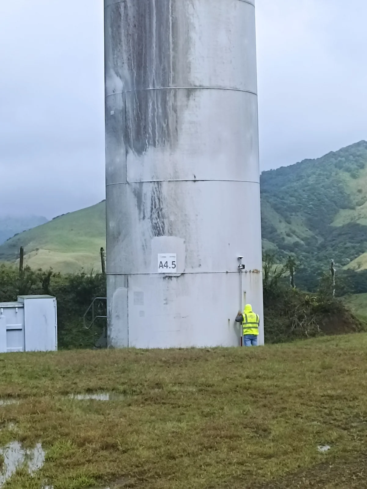 Survey measurements beside the base of a wind turbine